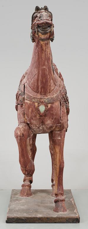 A large jade and agathe inlayed wooden carparisoned sculpture of a horse, presumably Ming dynasty.