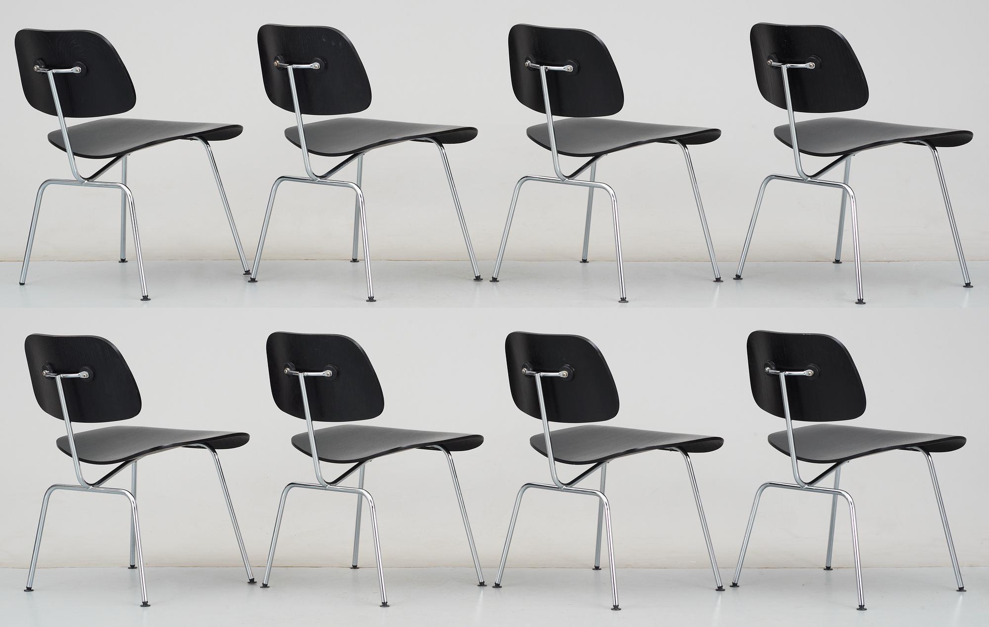 A set of eight Charles & Ray Eames 'DCM' chairs by Vitra.