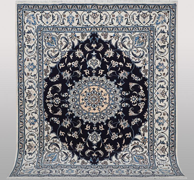 A carpet, Nain, part silk, ca 256 x 199 cm.