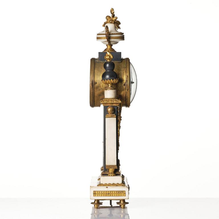 A marble and ormolu Louis XVI portico mantel clock, Paris, late 19th century.