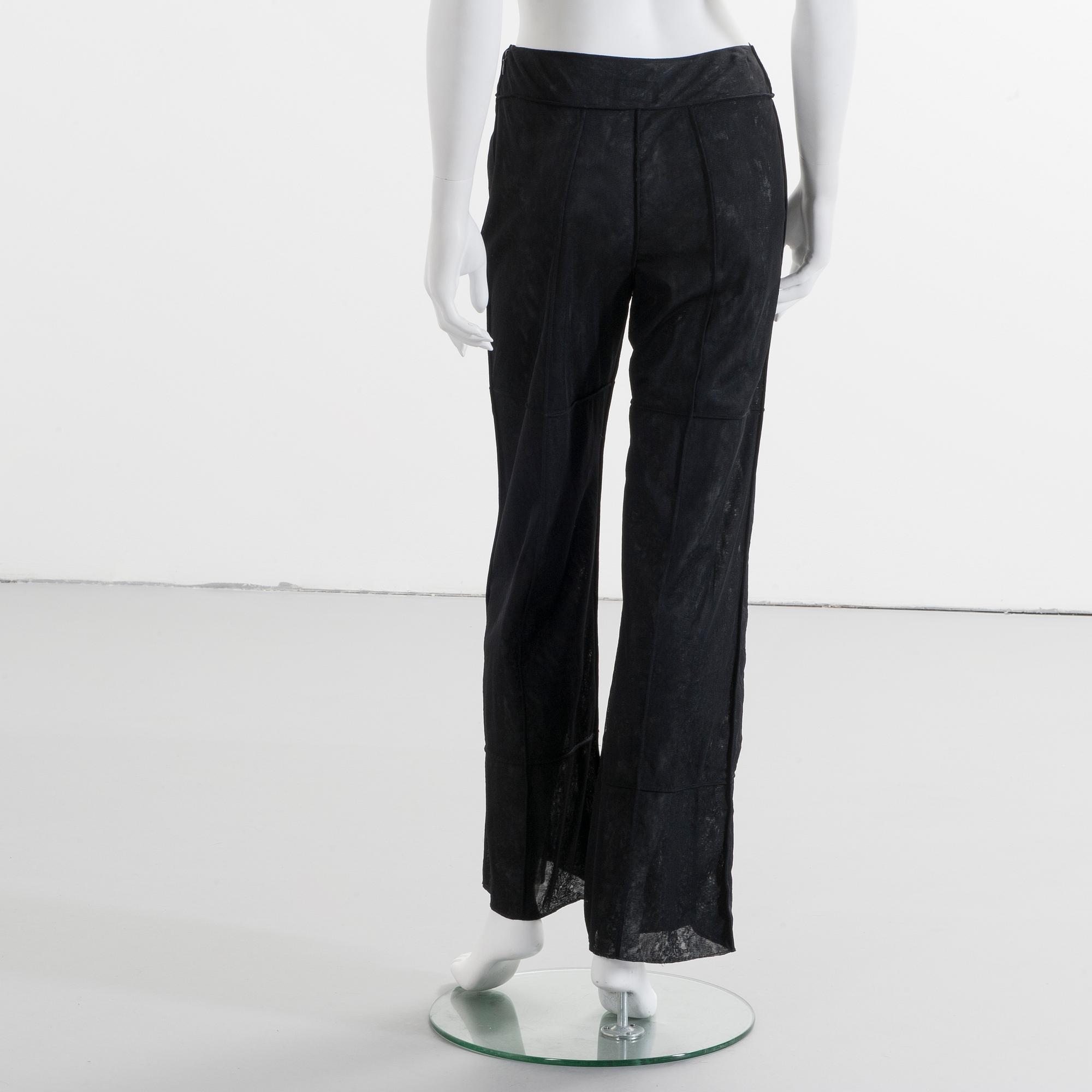 CHANEL, a black mesh evening pant.