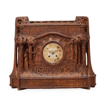 567. A Swedish Art Nouveau carved pine mantel clock, probably by Rackengruppen.