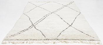 A Moroccan carpet, c. 282 x 150 cm.