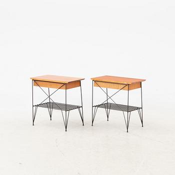 A pair of 1950s teak bedside tables.