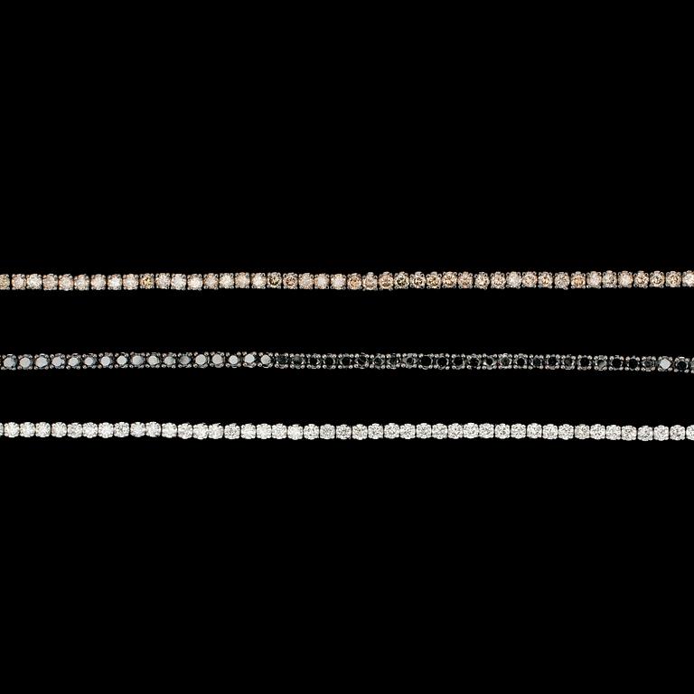 ARMBAND, 3 st, vita- svarta- och cognacsfärgade briljantslipade diamanter, tot. ca 9 ct.