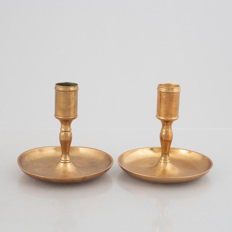 A set of five brass candlesticks, 18th / 19th Century.