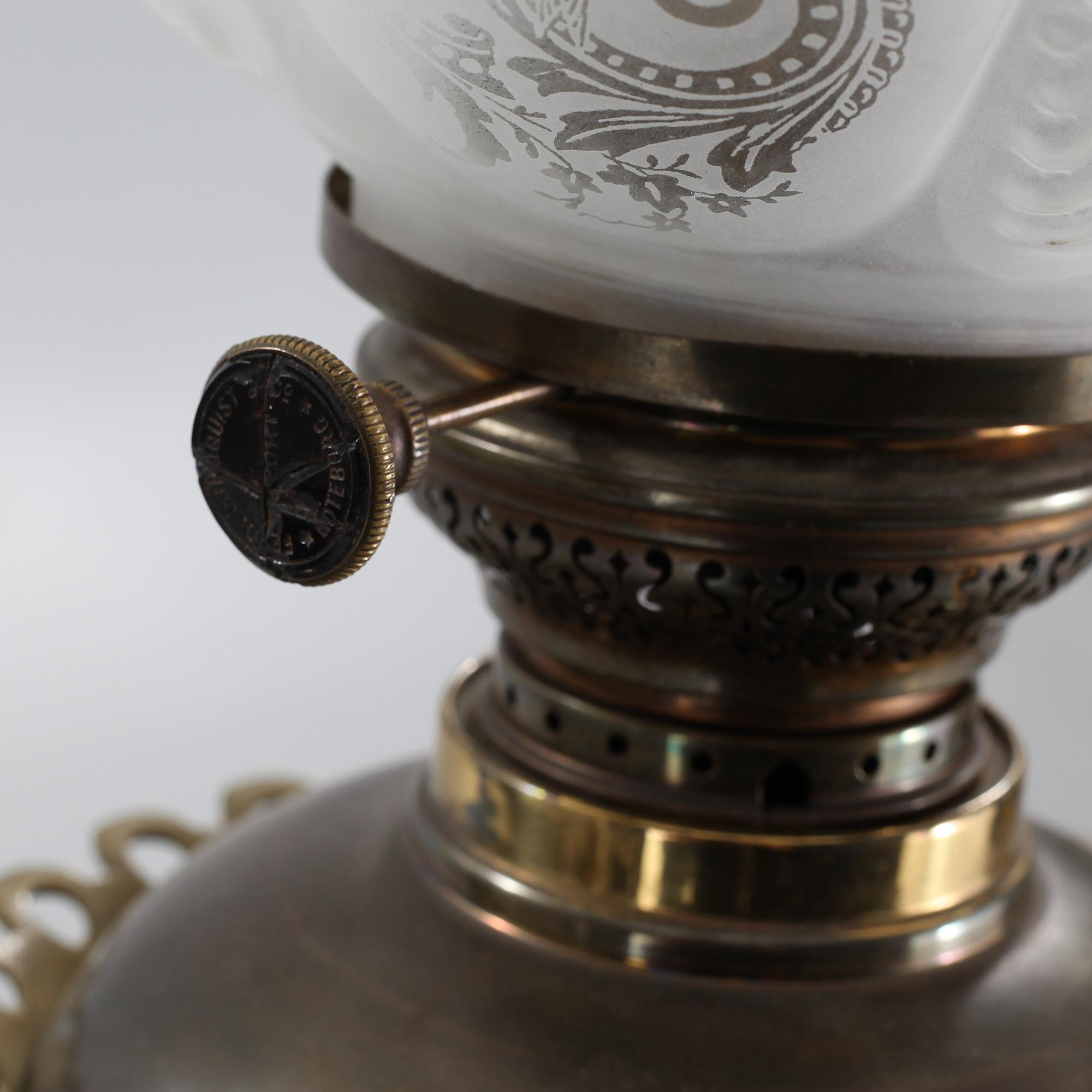 Two floor parafine lamps, 20th century.