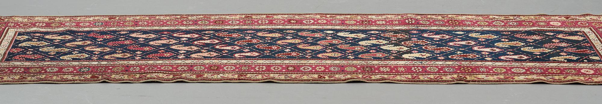Matto, a runner, an antique Karabagh, ca 268,5-278 x 98,5-103,5 cm.