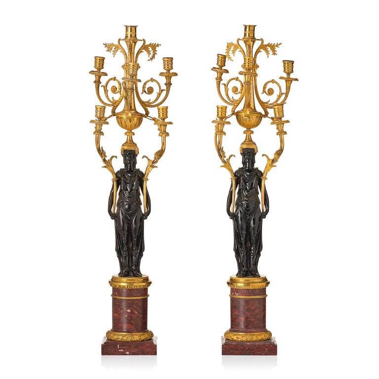 A pair of Louis XVI ormolu and patinated bronze six-branch candelabra attributed to François Rémond, late 18th century.