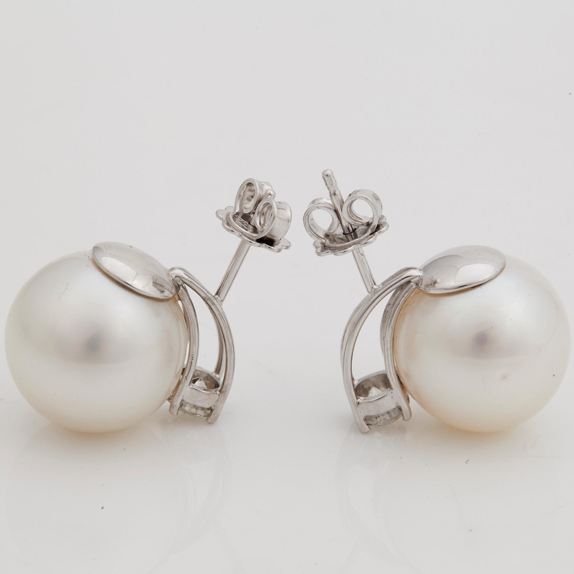 A pair of cultured South sea pearl and brilliant cut diamond earrings.