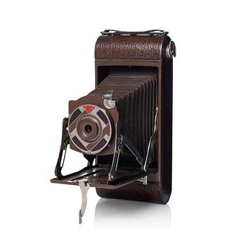 246. Walter Dorwin Teague, a folding camera in in a lacquered case, USA 1930s.