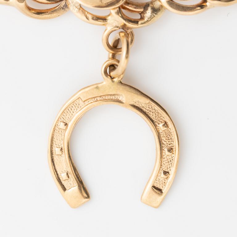 Armband 18K guld bismarcklänk, med berlocker.