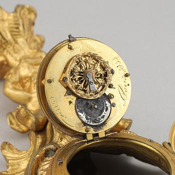 A late 19th century gilt bronze miniature wall clock, clock face signed Breguet a Paris.