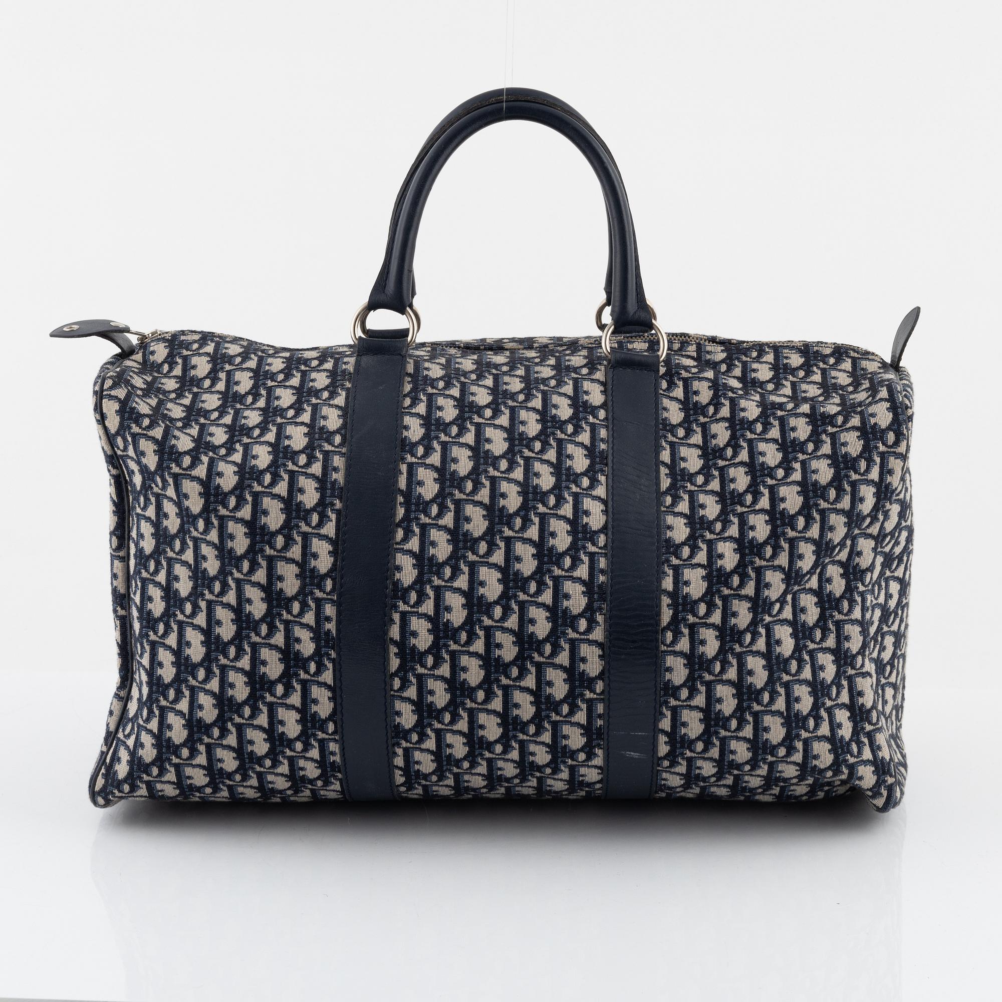 Christian Dior, a canvas weekend bag.