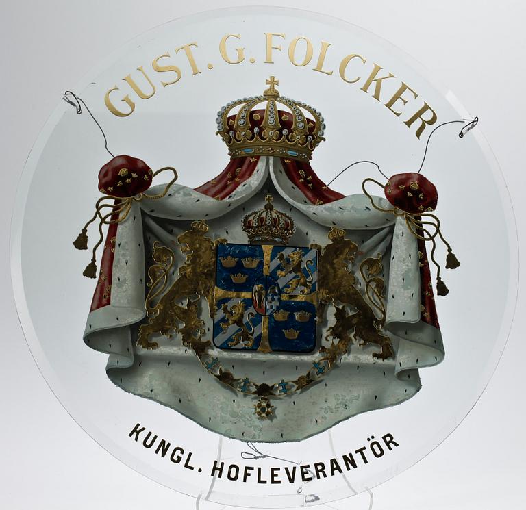 SKYLT, glas, "Gust. G. Folcker Kunglig hofleverantör".