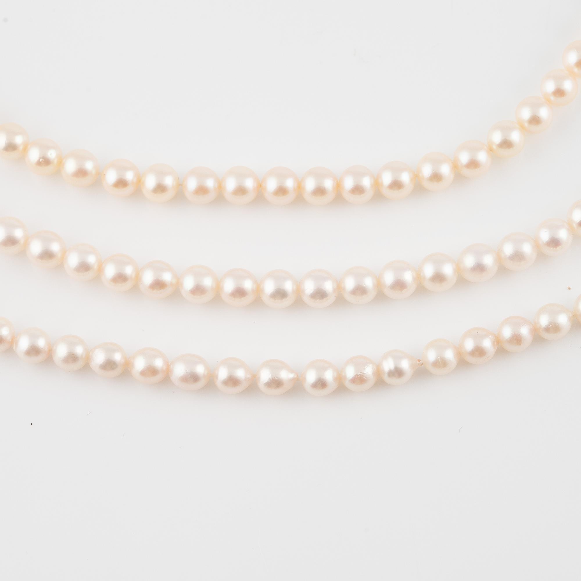 Three strands of cultured pearls, without clasps.
