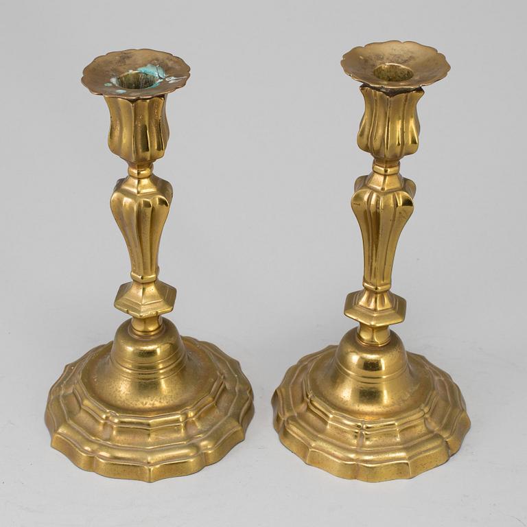 A pair of 18th century bronze candlesticks.