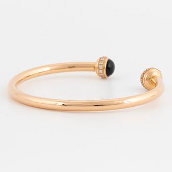 Piaget 18K rose gold, brilliant-cut diamonds and onyx cabochons.
