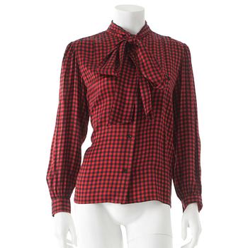 708. YVES SAINT LAURENT, a red and black silk blouse.