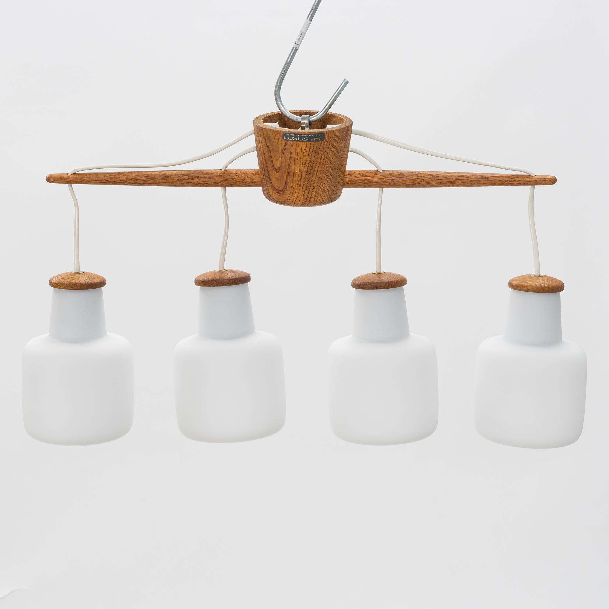Uno & Östen Kristiansson, an oak and glass ceiling light, Luxus, Vittsjö.