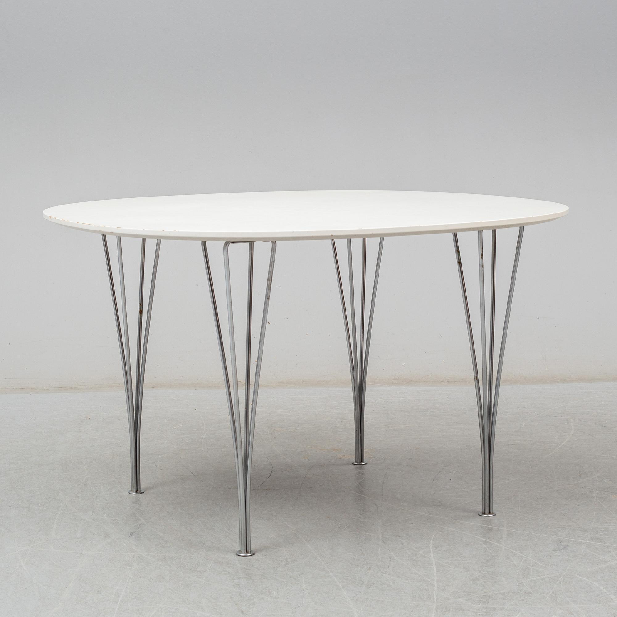 BRUNO MATHSSON & PIET HEIN, and ARNE JACOBSEN, a 'Supercirkel' table and two 'Myran' chairs, from Fritz Hansen.