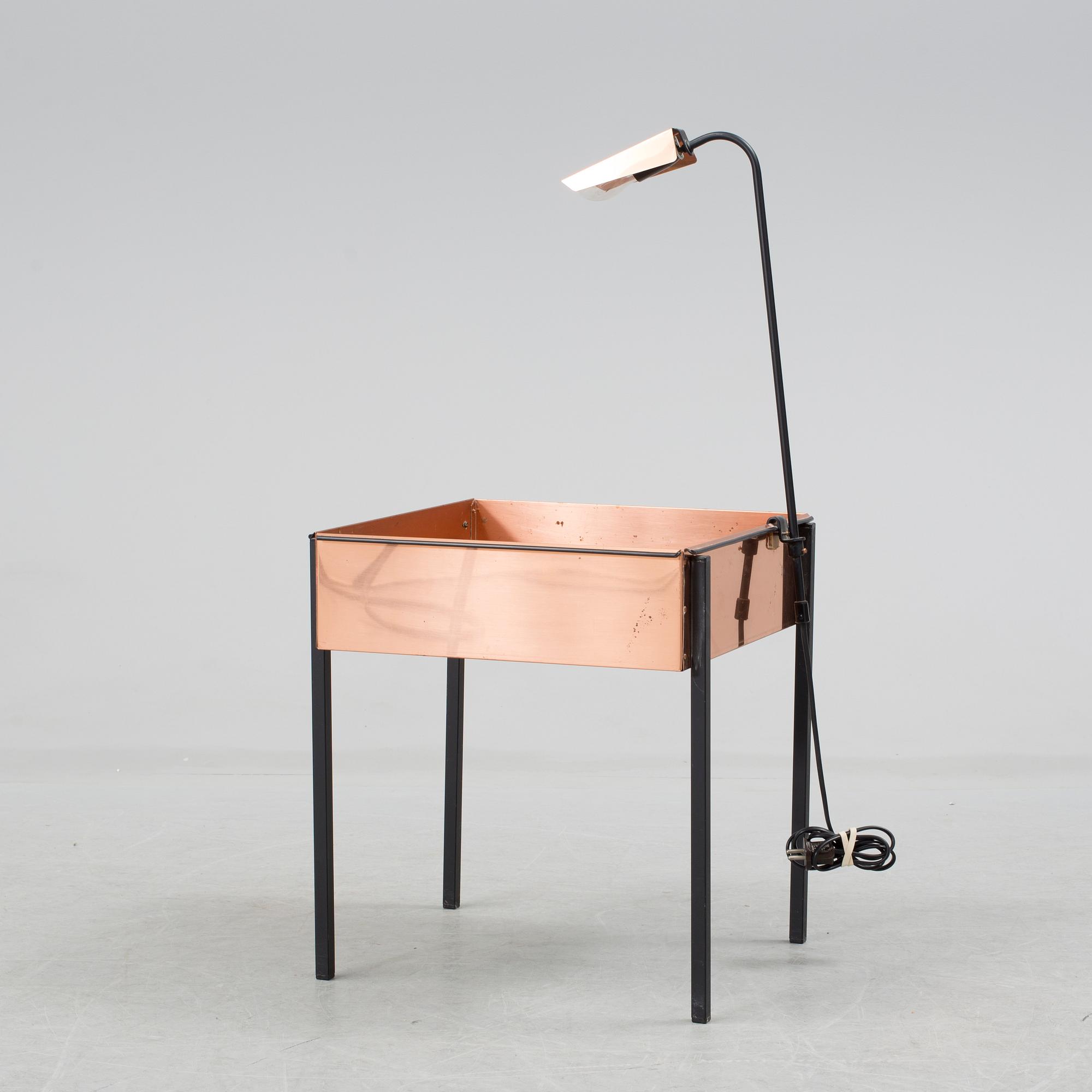 a flower table with a light by Gnosjö konstsmide in the second half of the 20th century.