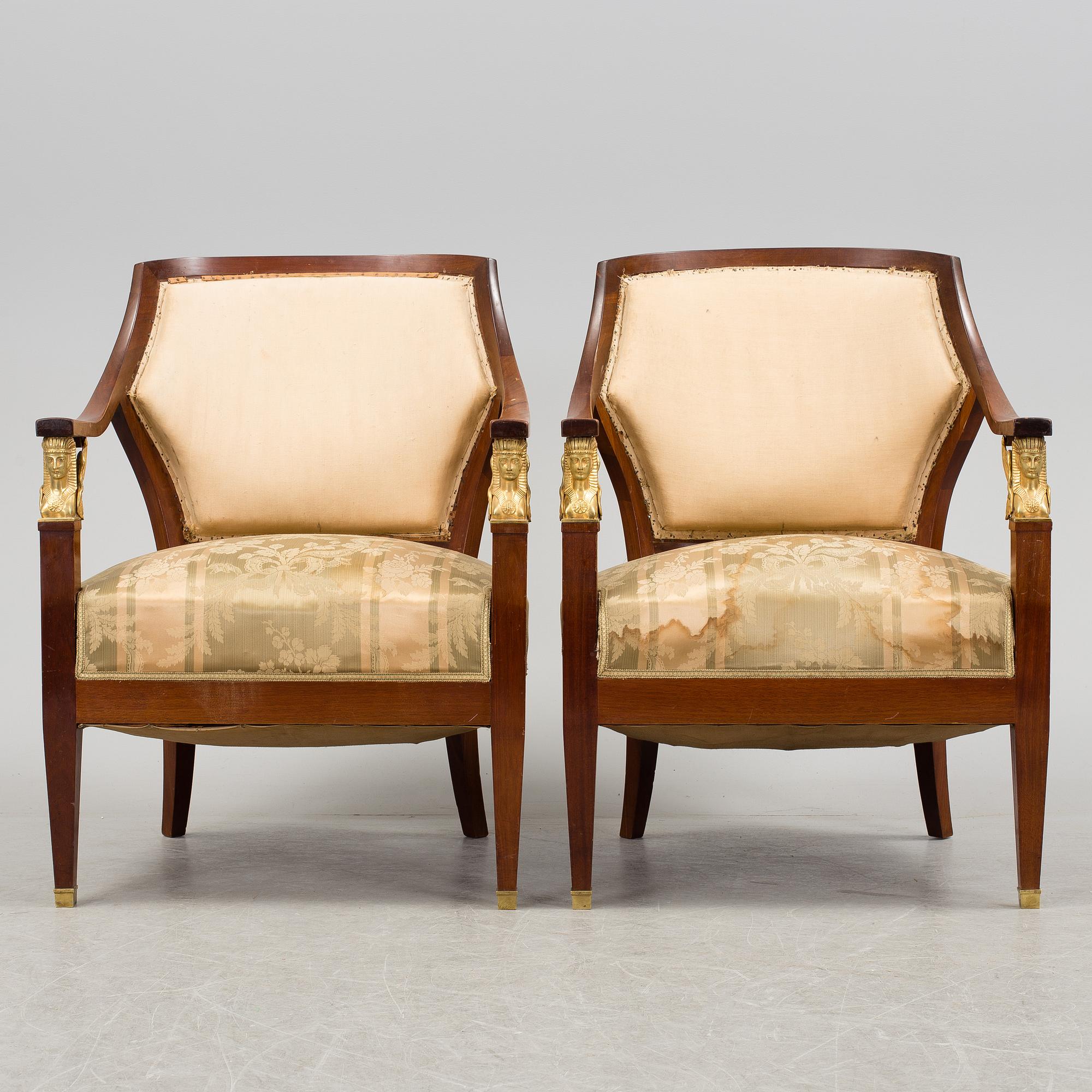 A pair of early 20th century Empire style armchairs.