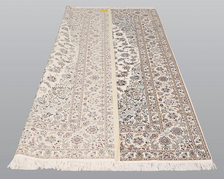 A carpet, Nain part silk s.k 6LAA, ca 310 X 209 cm.