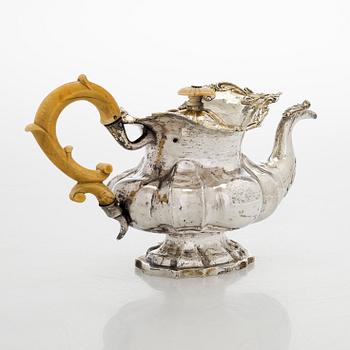 A parcel-gilt silver teapot, Moscow 1845.