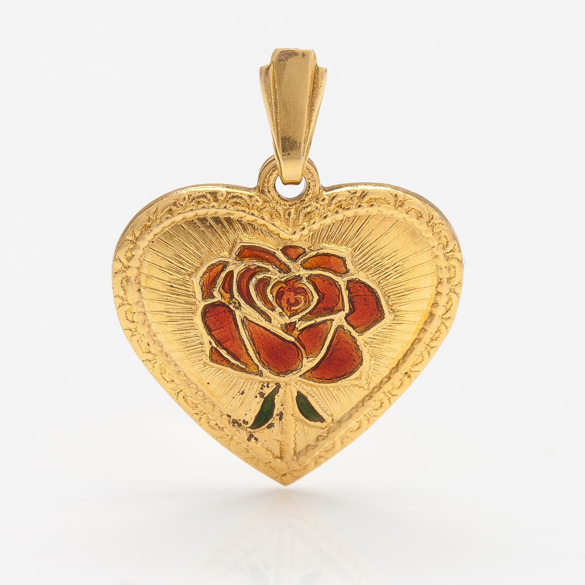 A 14K gold heart shaped pendatn with a rose in enamel.