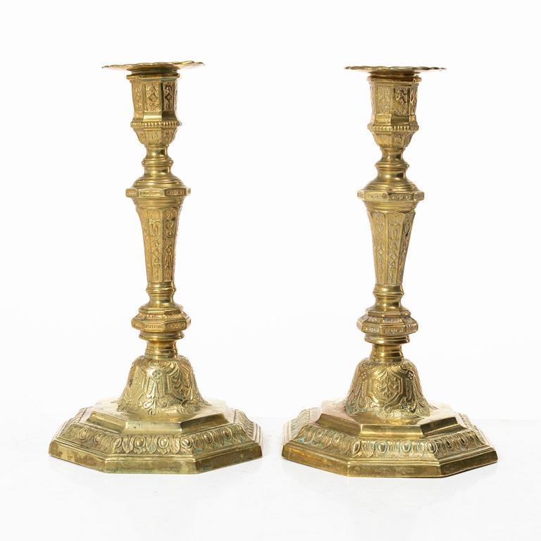 A pair of Louis XVI-style brass candle sticks, first half of the 20th century.