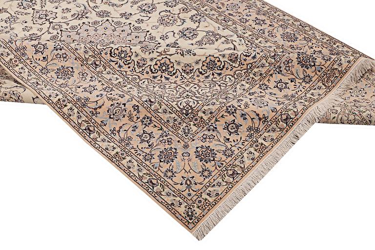 A carpet, nain, part silk, 6 laa, c. 316 x 210 cm.