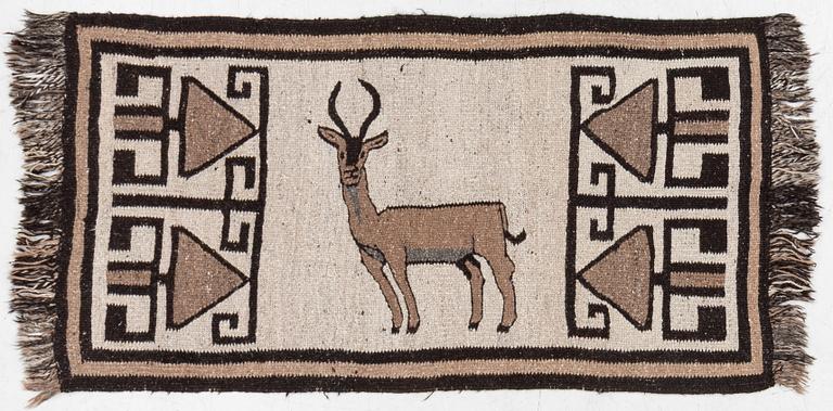 An oriental rug, c. 185 x 100 cm.