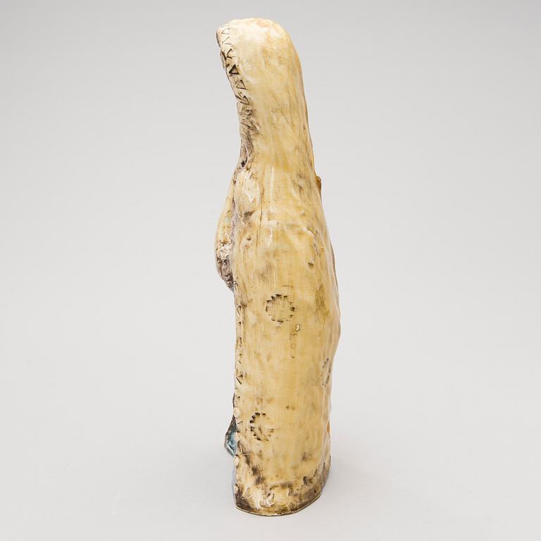 A stoneware figurine signed BRYK.