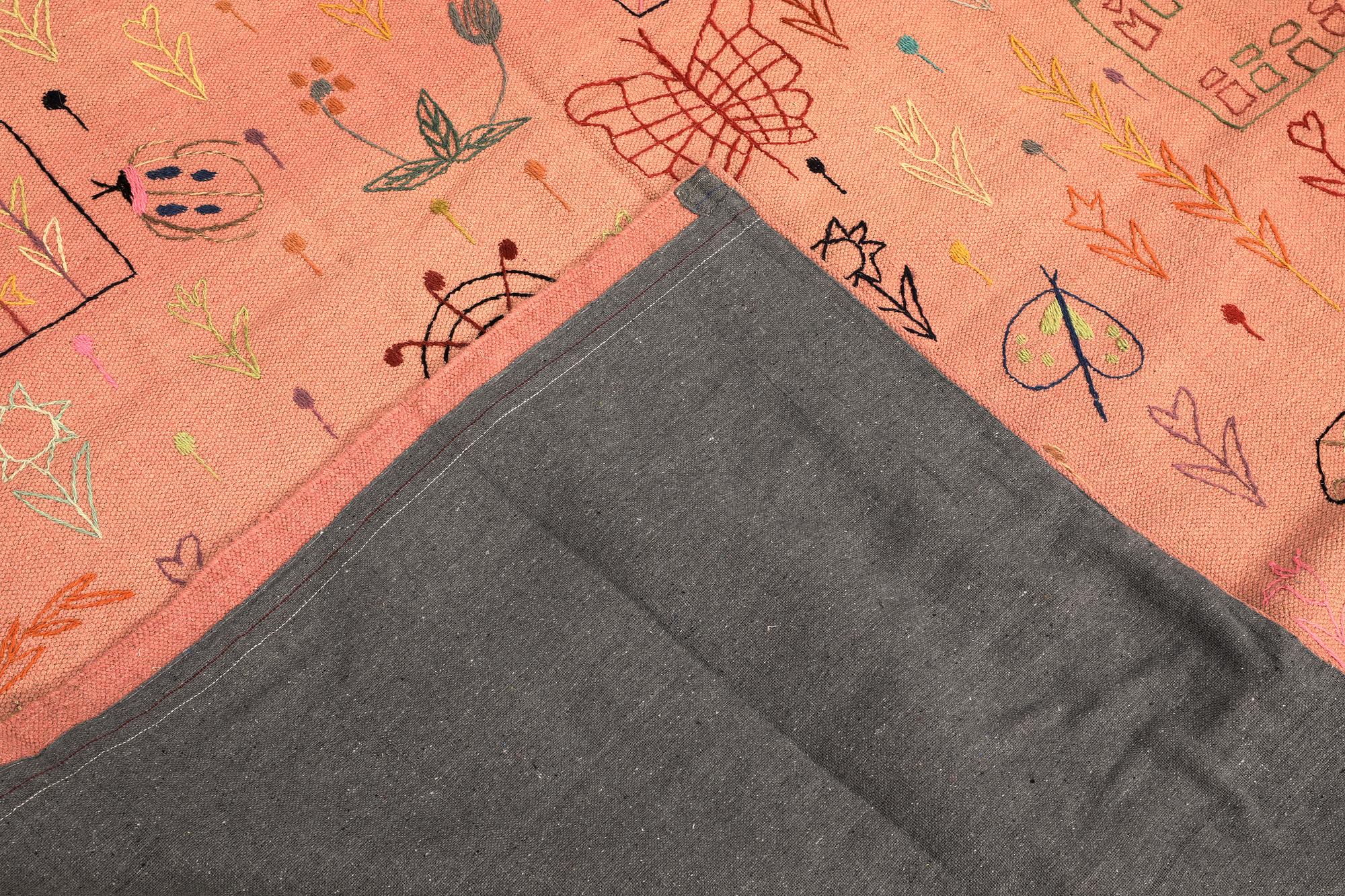 A hand-embroidered Kilim rug, approx. 241 x 180 cm.