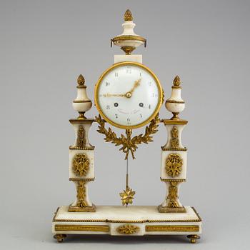 A Louis XVI marble and bronze mantel clock from the second half of the 18th century.