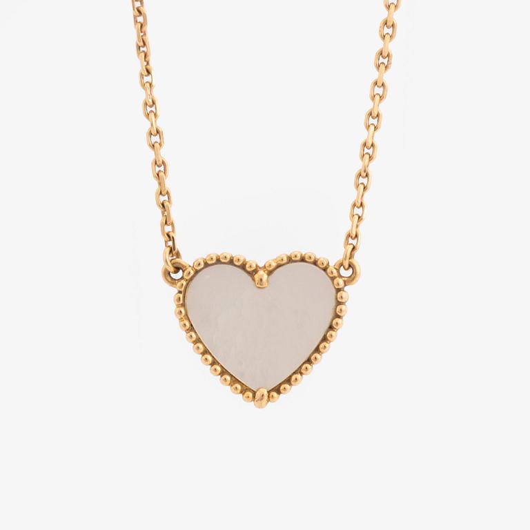 Van Cleef & Arpels, 18K gold and mother of pearl Alhambra heart necklace.