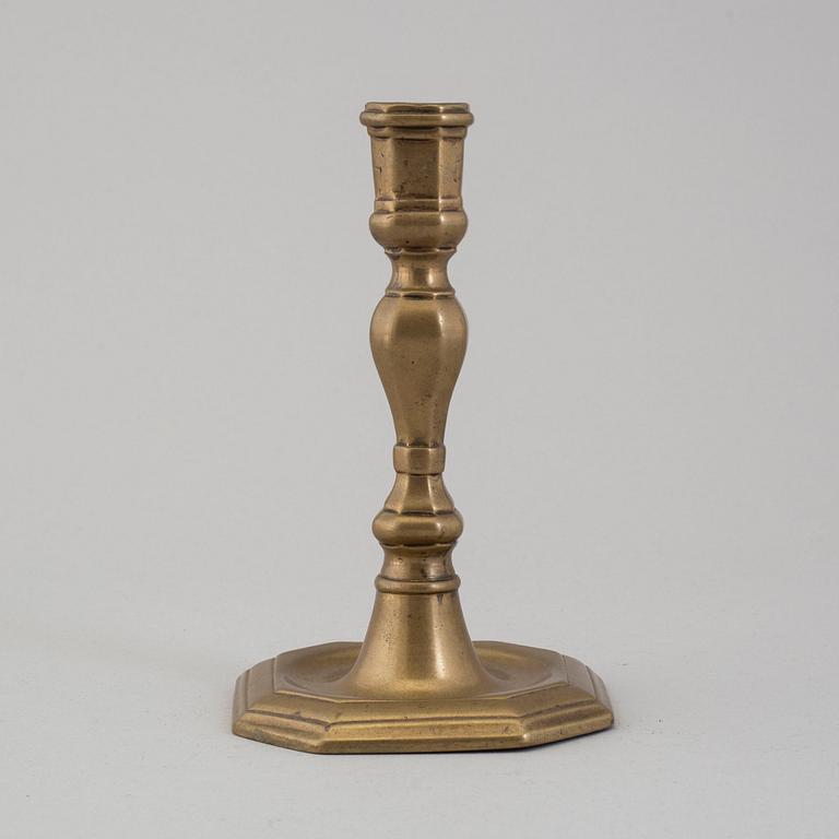 An 18th century bronze candlestick.