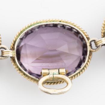 Garniture, necklace and bracelet silver with amethysts, brooch gold-coloured metal with purple paste stones,