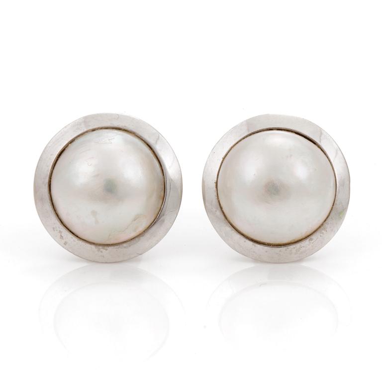 A pair of cultured mabé pearl earrings.