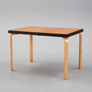 Alvar Aalto, a teak dining table, Artek, Finland, mid 20th Century.