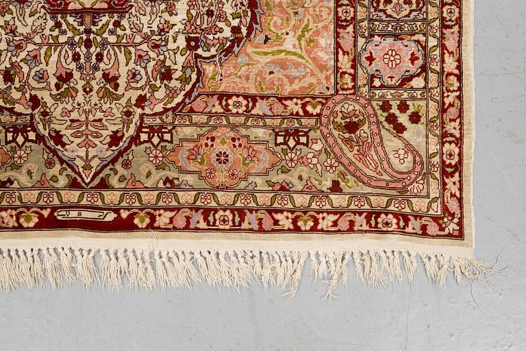 A rug, Old silk Hereke, ca 152 x 110 cm.