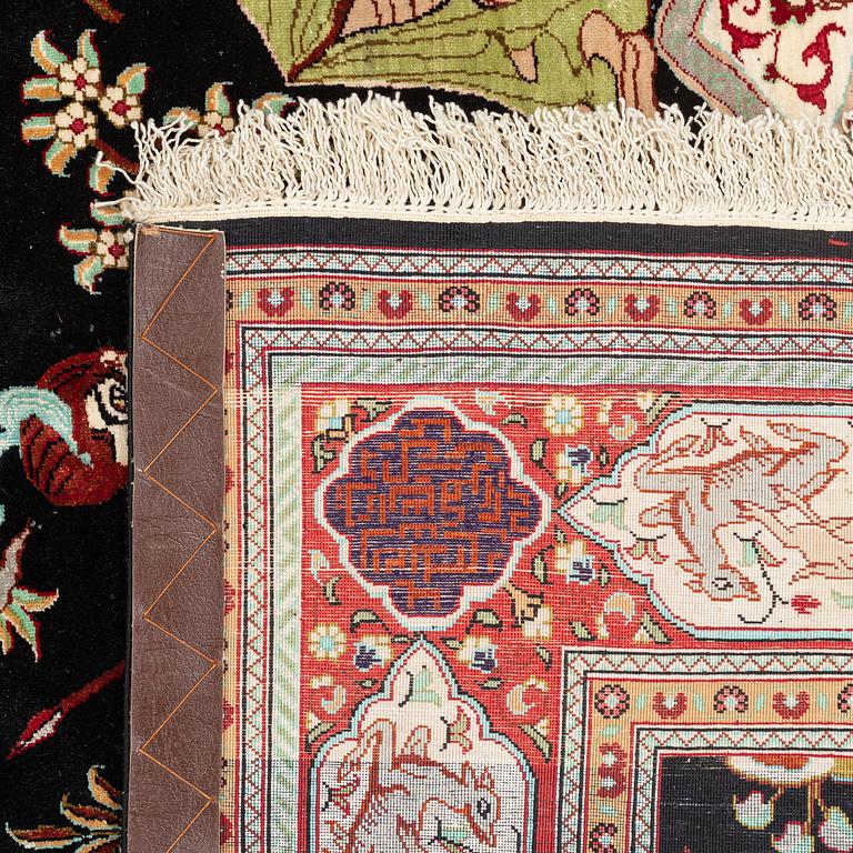 A silk rug, possibly Ghom, c 150 x 102 cm.