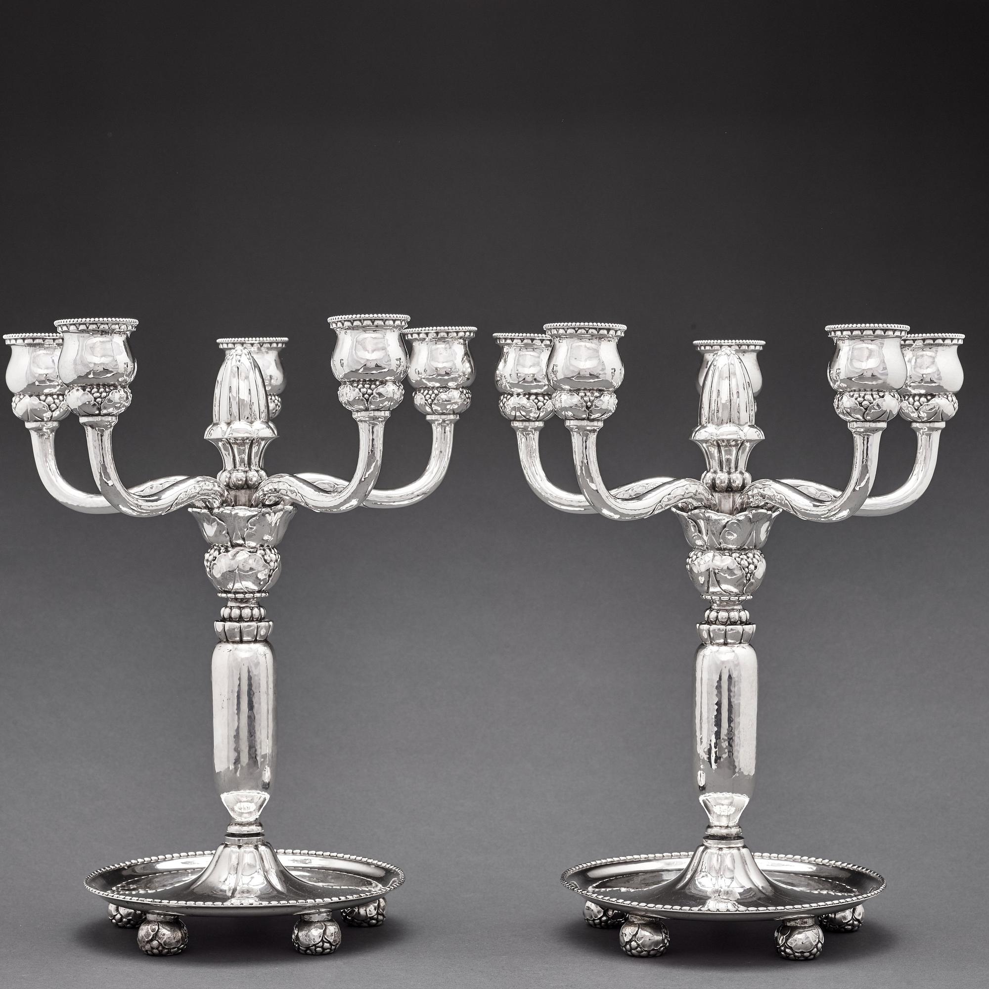Georg Jensen, a pair of 830/1000 silver five light candelabra, Copenhagen 1920, design nr 200.