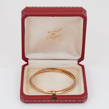 A Cartier "Trinity" bangle. 3 rings.