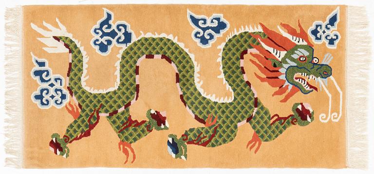 An old Tibet rug, c. 188 x 95 cm.