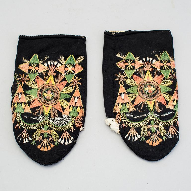 A pair of 19th century folk art brides mittens and a congratulation picture.