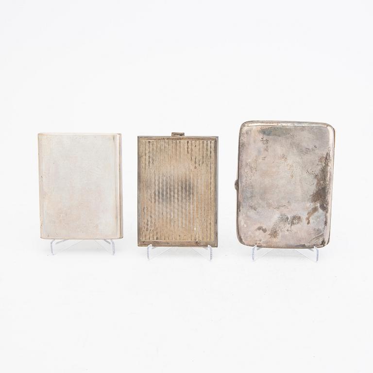 A set of three different 20th century silver cigarette cases, weight in total 456 grams.