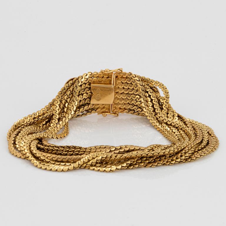 Armband 18K guld med kvarts-kattöga.