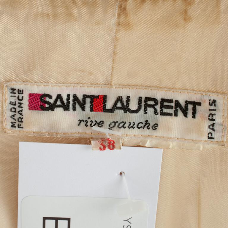 YVES SAINT LAURENT, a creme color silk jacket.